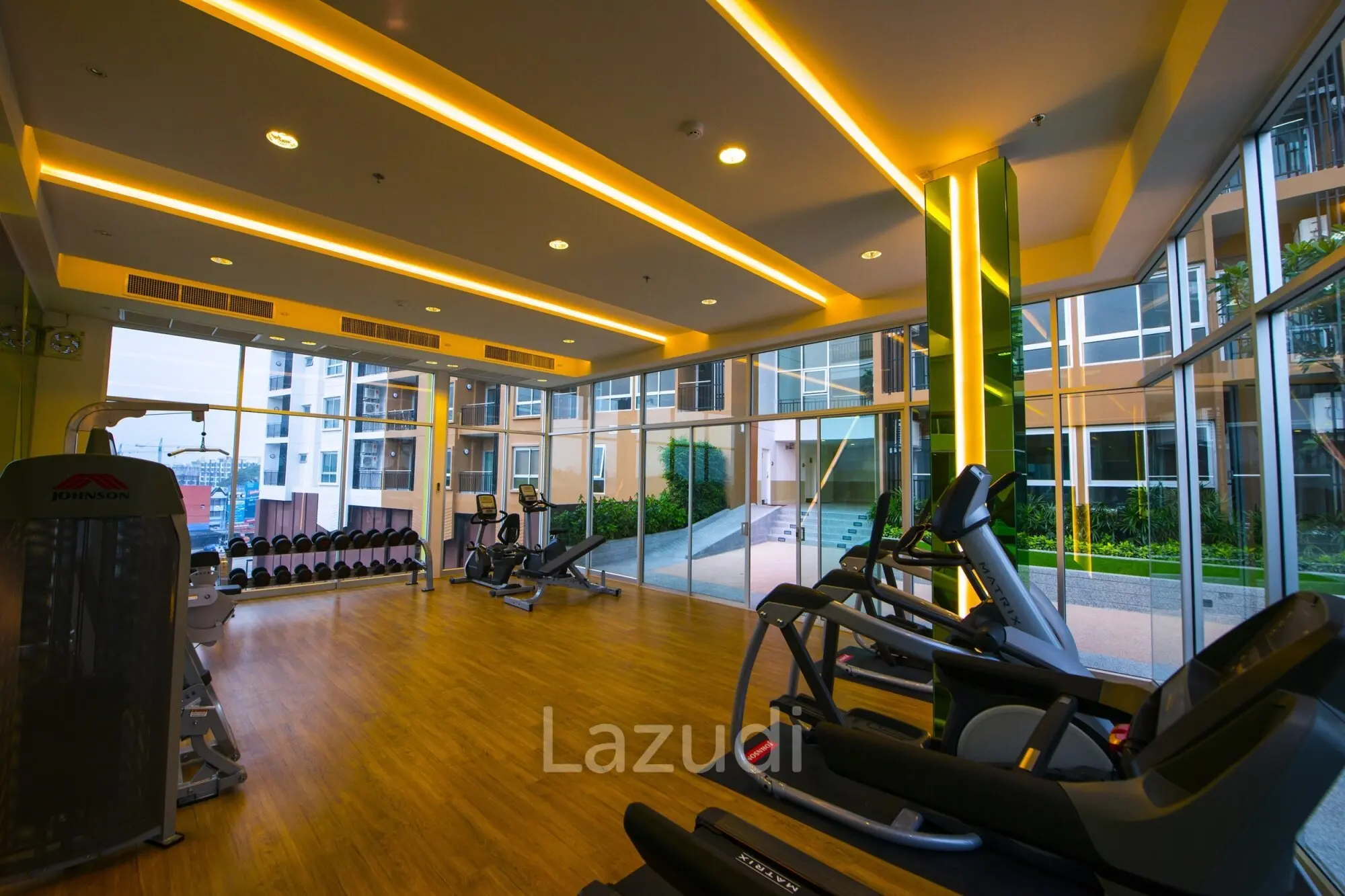 Modern fitness center with cardio and weight equipment at Supalai Monte 1 Chiang Mai