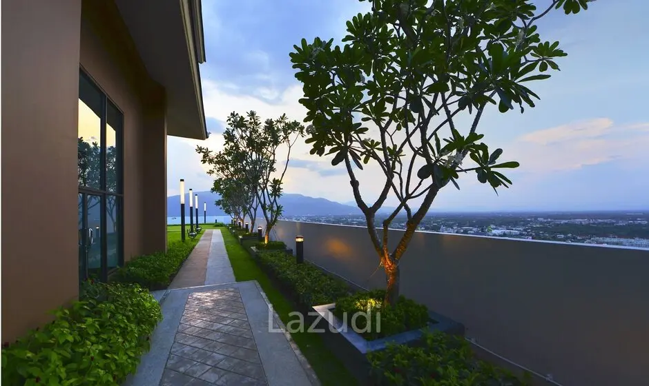 Serene rooftop garden with tropical plants and mountain views at Supalai Monte 1 Chiang Mai